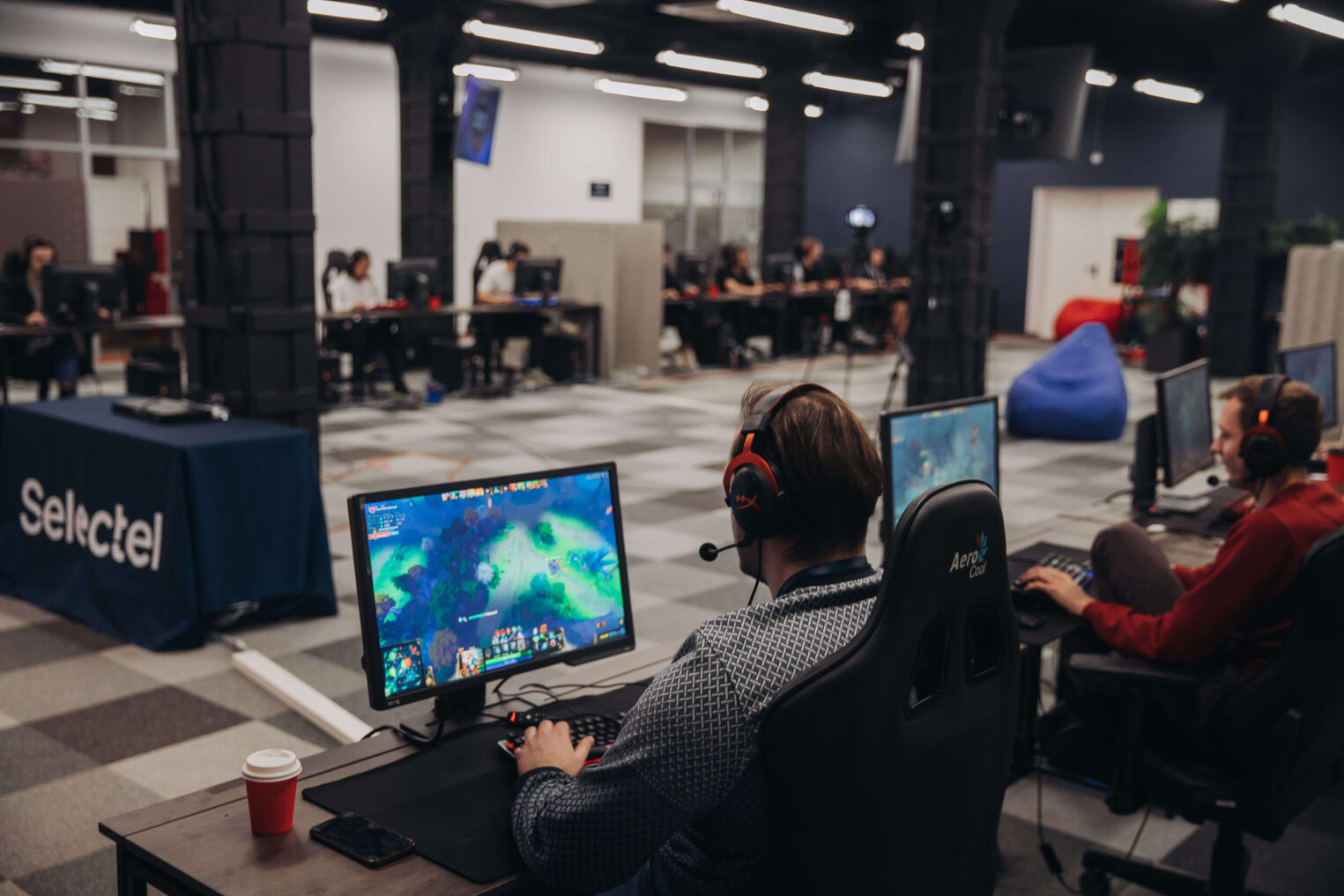A team of professional gaming hardware testers analyzing screen benchmarks
